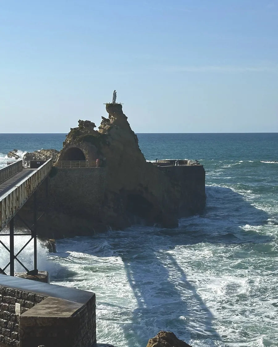 The Rocher de la Vierge and its iron footbridge, with the waves