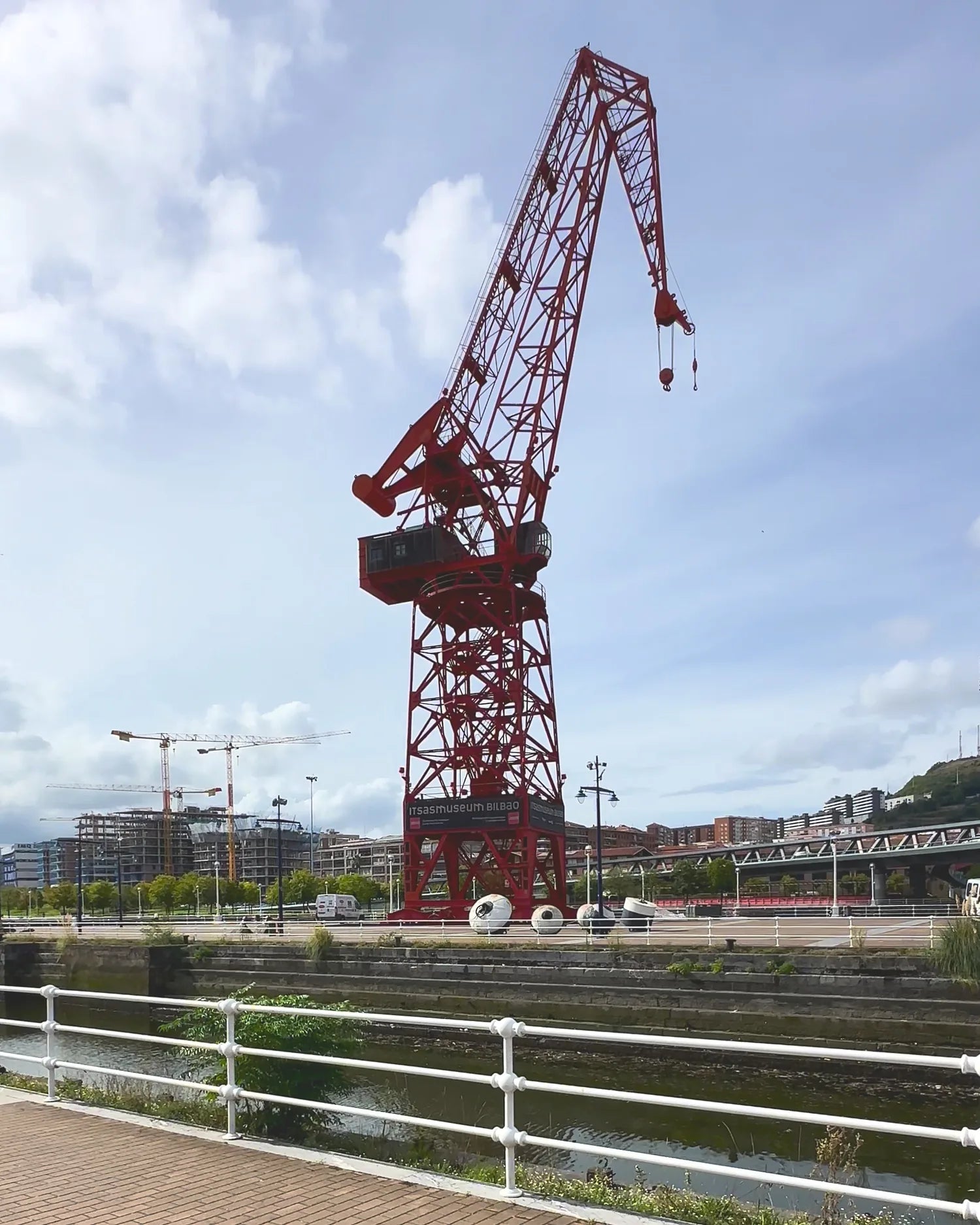 The Carola crane over the Bilbao estuary under a clear sky